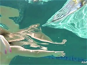 huge-boobed blondes Alix and Cherie go skinny dipping