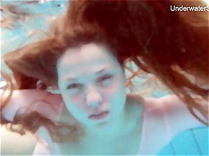 ginger-haired Simonna flashing her bod underwater